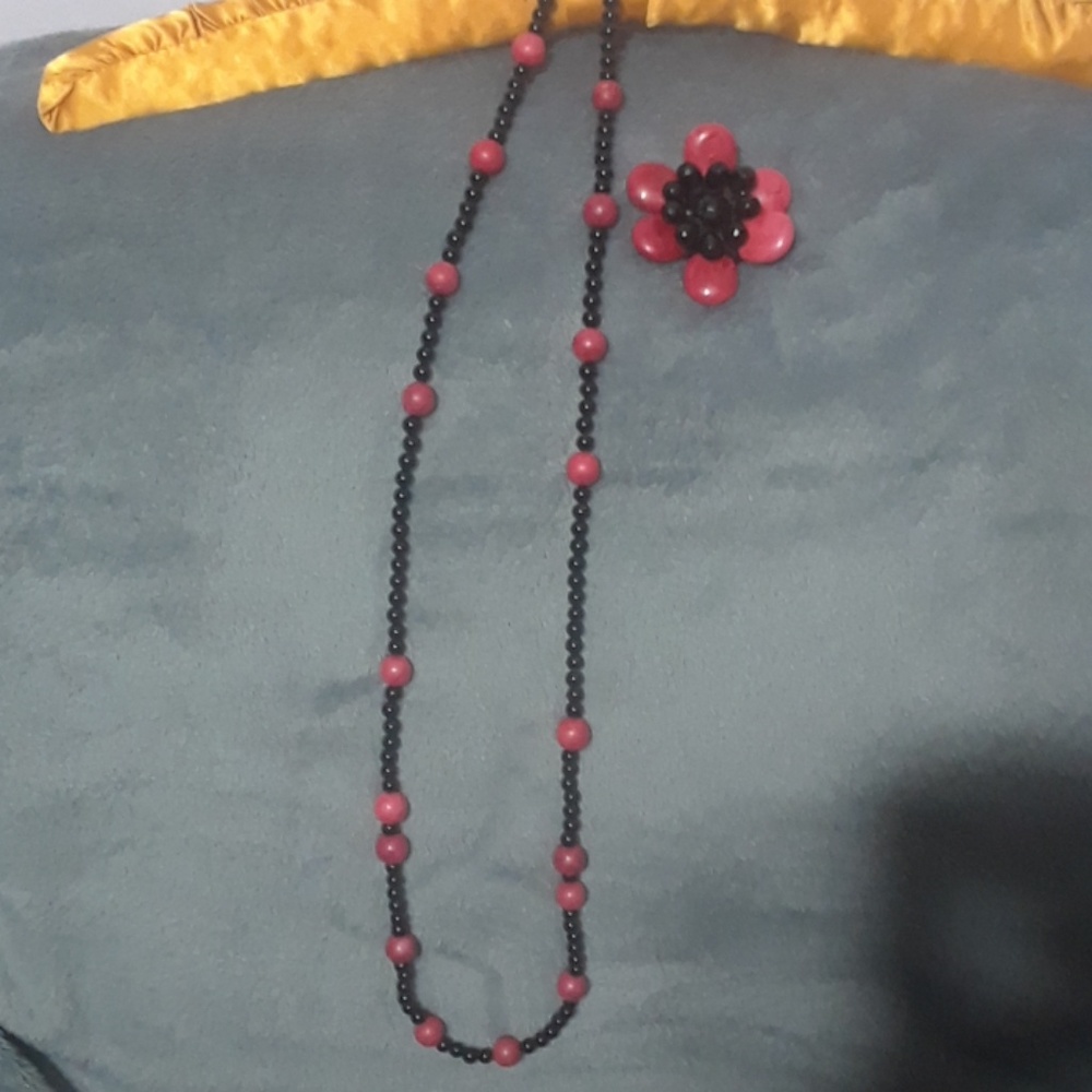Black and red beaded necklace and pendant